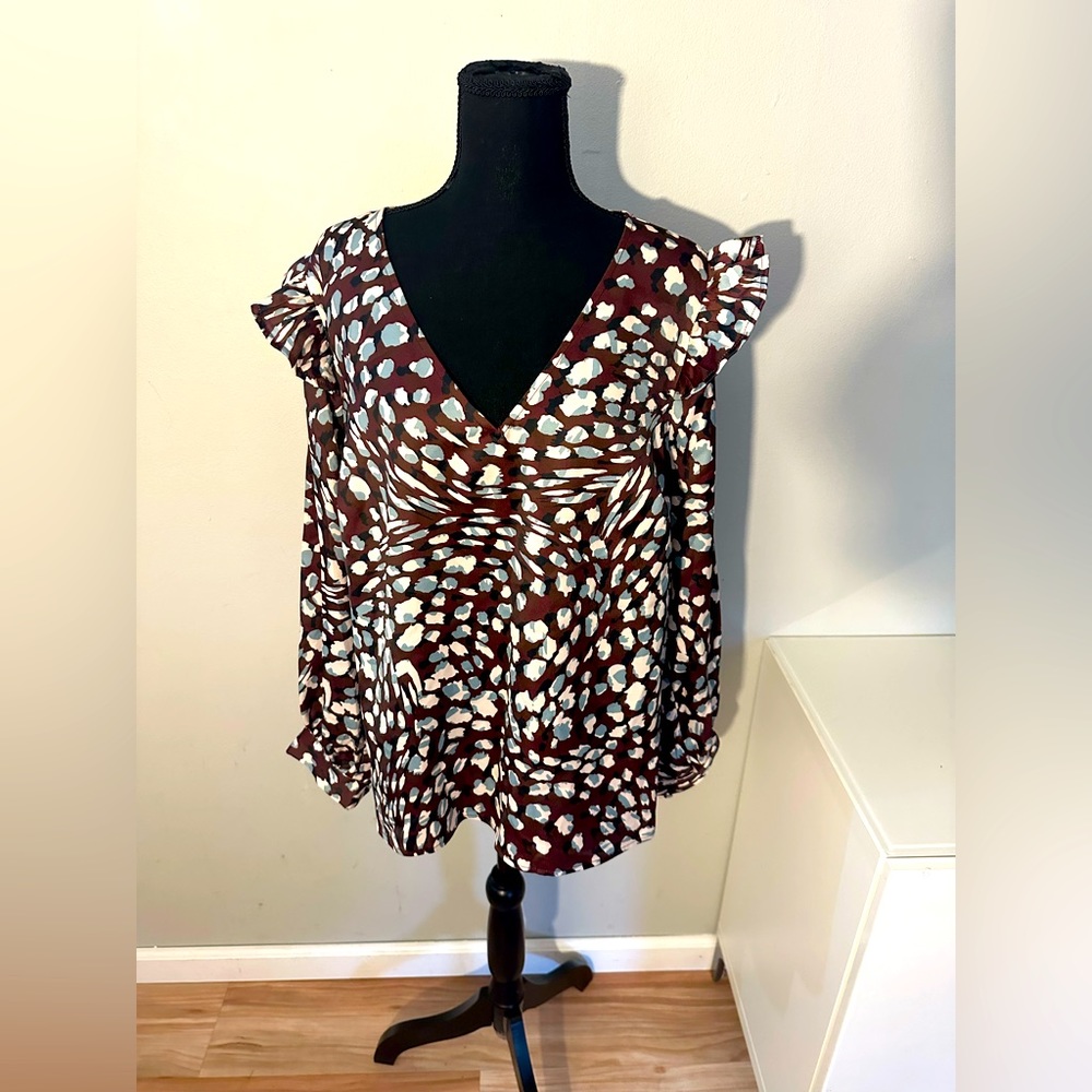 NWT. Eloquii blouse. Brown with blue and white print. Very nice for fall.